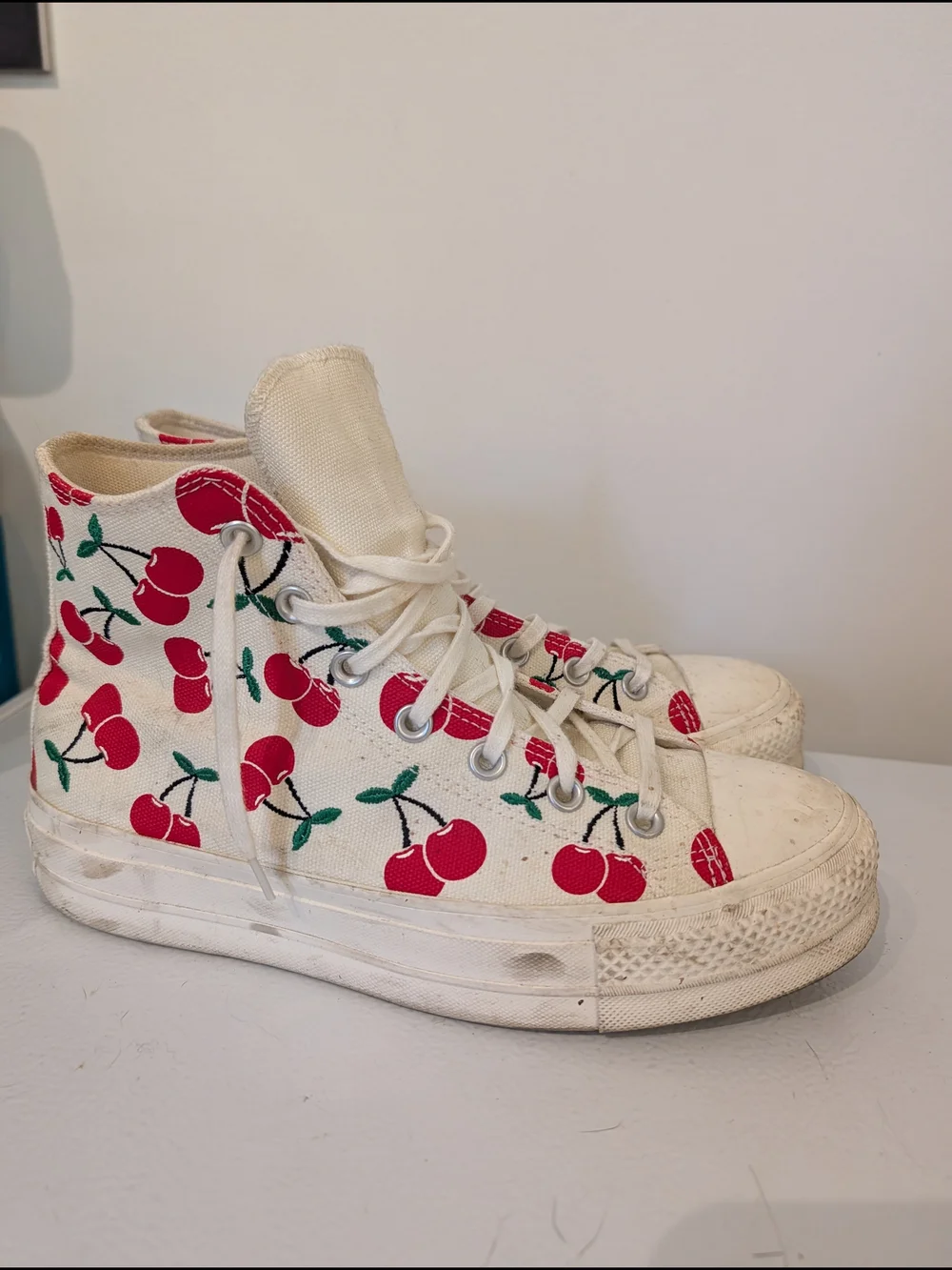 Converse Cream High-Top Sneakers with Red Cherry Accent